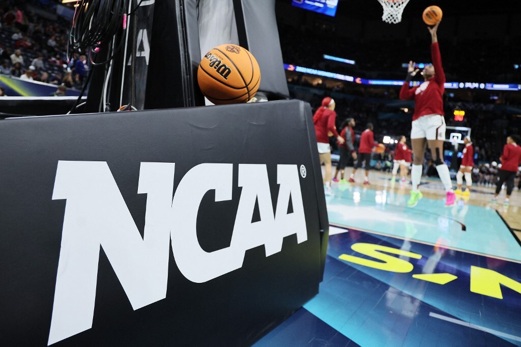 The NCAA logo and a game ball as the South Carolina Gamecocks warm-up before the game against the UConn Huskies.